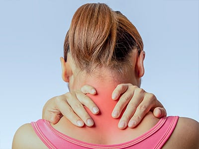 A woman suffering from servical back/neck pain